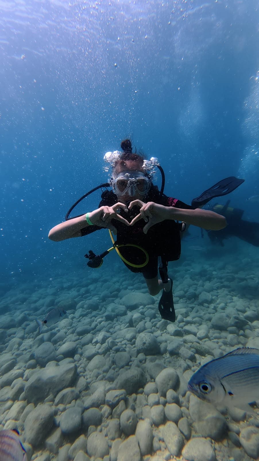 Oasis Dive Center underwater gallery photo showing divers and Mediterranean marine life